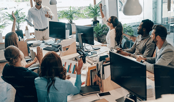 A legal team collaborating around their desks